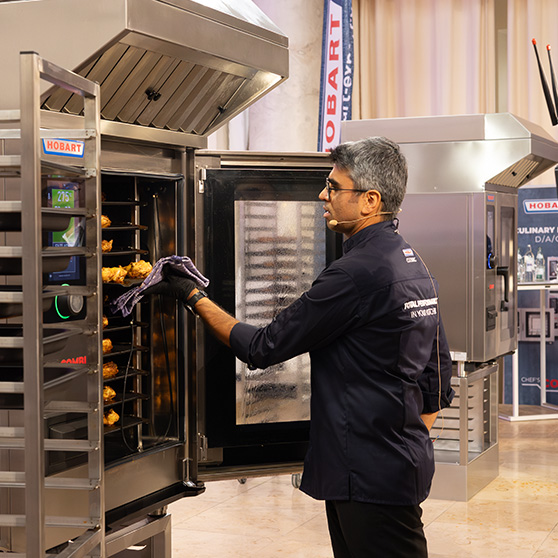 Professional use of a HOBART CHEF'S COMBI unit – touchscreen operation at high temperature