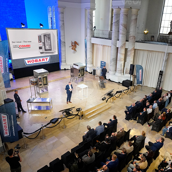 Stage presentation of the new CHEF'S COMBI by HOBART in front of a professional audience in a formal hall