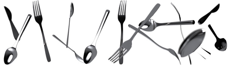 Falling cutlery – forks, knives, and spoons in dynamic positions against a white background