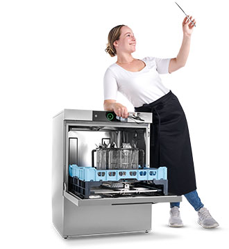 A woman stands next to a HOBART dishwasher holding a shiny knife in her hand