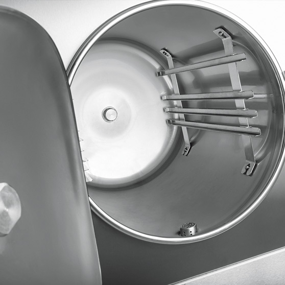 Interior of a HOBART dry steam high-speed cooker made of stainless steel with supports for GN containers, hygienic design for professional cooking technology.