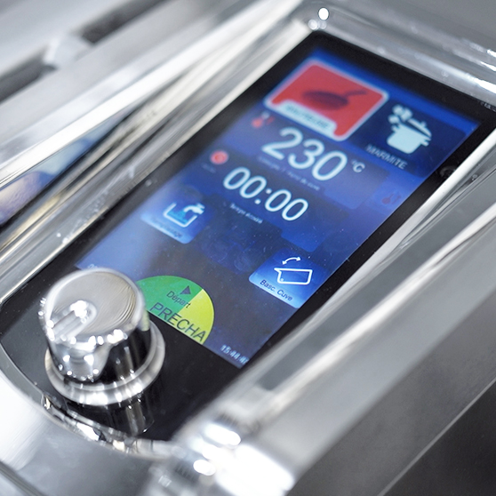 Close-up of the digital control display of a HOBART Precipan, showing 230 °C temperature, timer, and cooking functions such as frying and boiling, modern touchscreen interface with rotary knob in stainless-steel housing for commercial kitchens.
