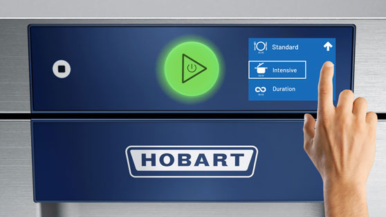 Control panel of a HOBART dishwasher with touchscreen, selecting the intensive cycle, green start button, and HOBART logo for professional dishwashing.